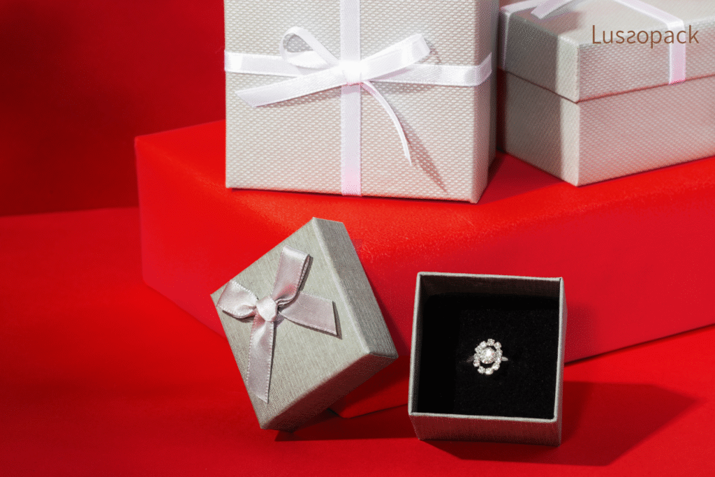 Custom luxury ring packaging box with satin ribbon and diamond ring